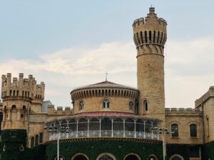 Front view of Bangalore Palace with its stone architecture and historic towers in Bengaluru, India.